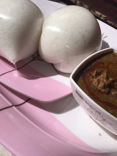 A picture of Baobab leaves soup with rice swallow.