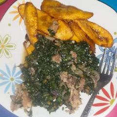 A picture of Fried plantain with vegetable and beef.