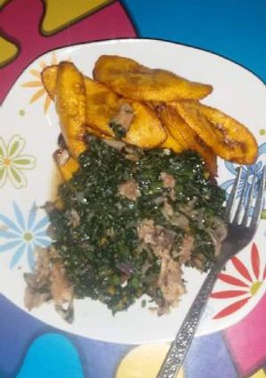 A picture of Fried plantain with vegetable and beef.