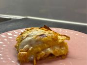 Una foto di lasagna zucca