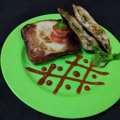 Peri Peri Mayo-Veg Sandwich Toasted In Gas Toaster A picture of Peri Peri Mayo-Veg Sandwich Toasted In Gas Toaster.