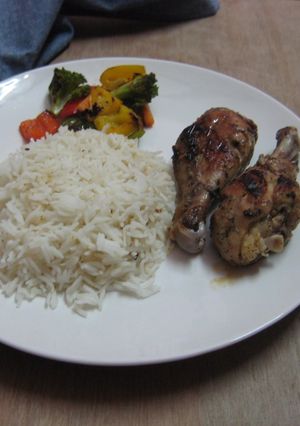 A picture of Grilled Chicken with rice and assorted veggies.