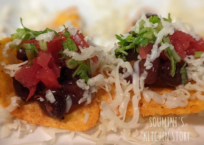 Homemade Nachos with refried beans and salsa