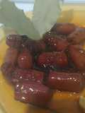 Salchicha a la Coca-Cola con cebolla