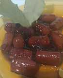 Salchicha a la Coca-Cola con cebolla