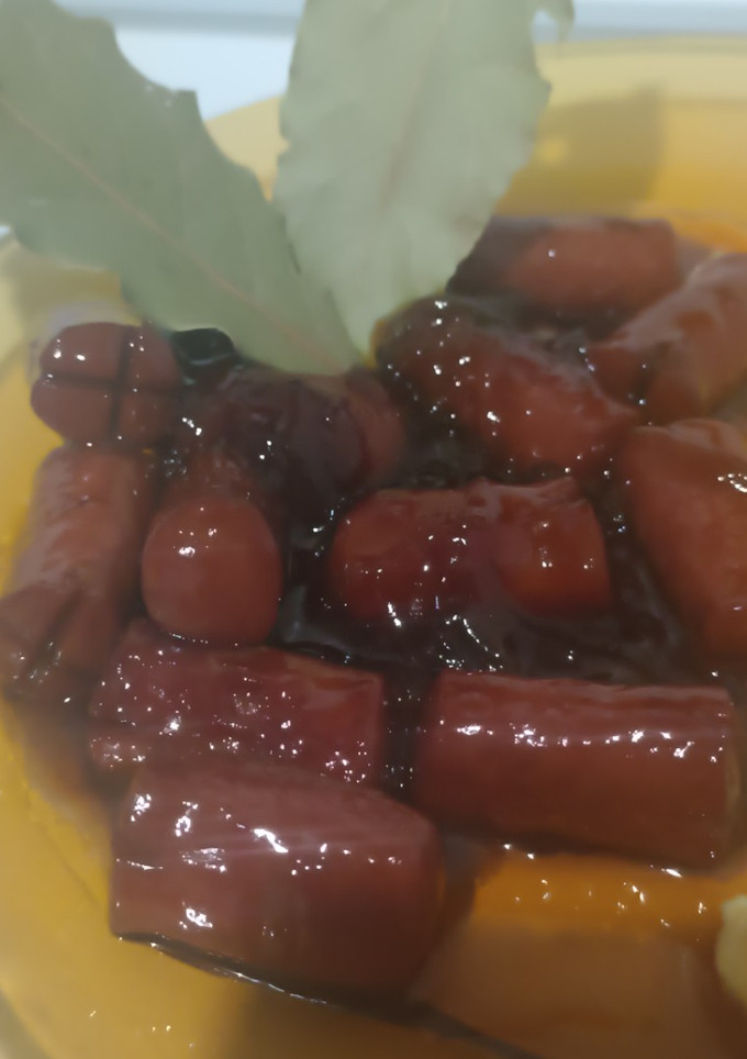 Una foto de Salchicha a la Coca-Cola con cebolla