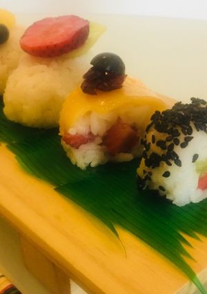 A picture of Fresh fruit sushi platter.
