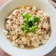 A picture of Steamed Tofu with minced pork and eggplant.