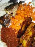 Rice with fried plantain,carrots and fried fish