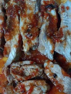 Una foto de Pechito de cerdo con dulce de tomate