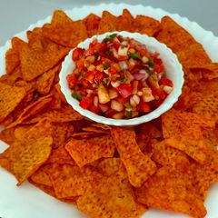 A picture of Salsa with Nachos.