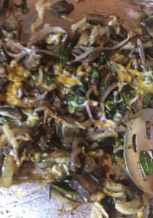 A picture of Sheet pan mushrooms onions and ramps.