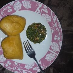 A picture of Moimoi with spinach sauce.