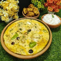A picture of Kadhi (Karhi) Pakora 💛🧡.
