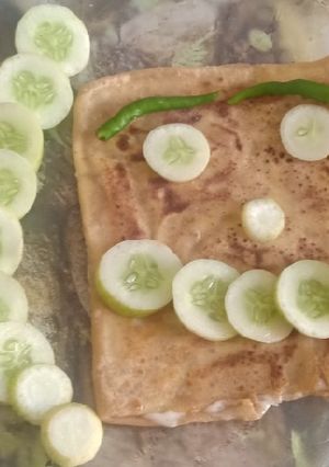 A picture of Cheese stuffed paratha with smile emoji.