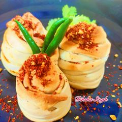 A picture of Baked layered vada Pav.