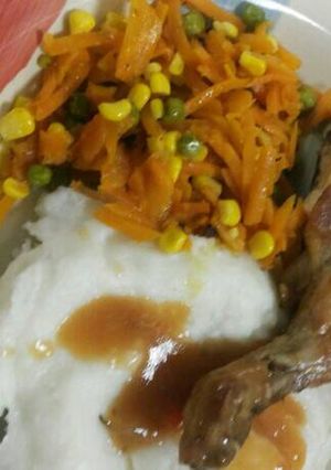A picture of Chicken and mix salad.