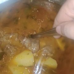 A picture of Aloo gosht.