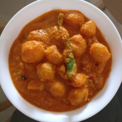 A picture of Dum Aloo (Baby Potatoes In Rich Gravy).