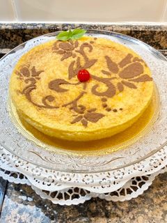 Una foto de Pastel de nata y coco muy húmedo