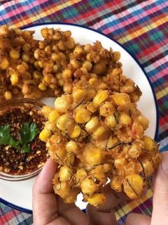 A picture of Sweet Corn Fritters with HomeMade Red Curry Paste Thai Style • Tod Mun Kao Paok |ThaiChef Food.