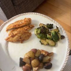 A picture of Seasoned Chicken Tenders with Roasted Potatoes and Brussels Sprouts.