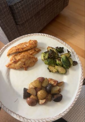 A picture of Seasoned Chicken Tenders with Roasted Potatoes and Brussels Sprouts.