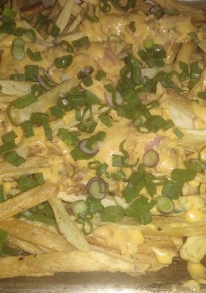 Una foto de Papas con cheddar y bacon 👍