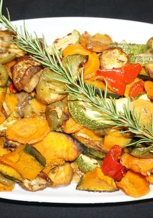 A picture of Roasted vegetables with fresh herbs.