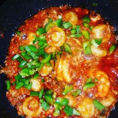 A picture of Mushrooms, Prawns and Mashed Red Snapper in tomatoe Sauce.