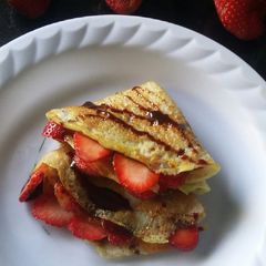 A picture of Strawberry chocolate syrup crepes.