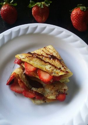 A picture of Strawberry chocolate syrup crepes.
