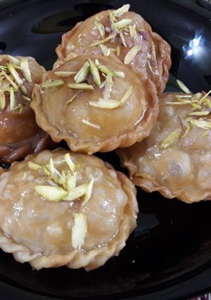 A picture of Coconut with malai khajur stuff gujiya.
