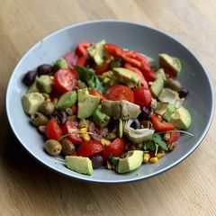 A picture of Avocado and rocket salad.