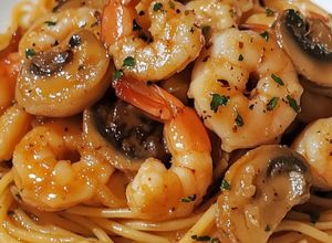 Una foto de Spaghettis con gambas y champiñones al ajillo