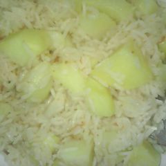 A picture of Potatoes mixed with rice.