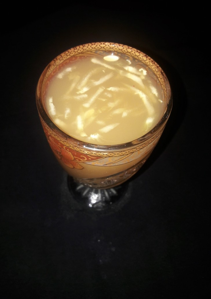 A picture of Tamarind juice with cucumber.