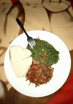 A picture of Stewed Omena served with kales and ugali.