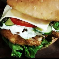 A picture of Zinger burger with fries.
