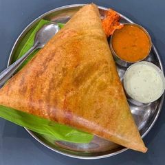 South Indian dosa with coconut chutney sambhar A picture of South Indian dosa with coconut chutney sambhar.