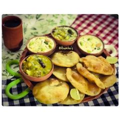 A picture of Kolkata Style: Hinger Kochuri or Hing Kachoris with Hing-Potato Curry.
