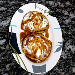 A picture of Grilled pineapple with vanilla icecream.