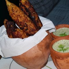 A picture of Raita (tawa kabab ke sath).