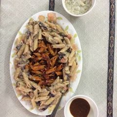 A picture of Colourful white and red pasta.