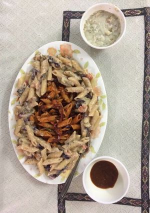 A picture of Colourful white and red pasta.