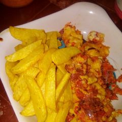 A picture of Fried Irish potatoes with fried eggs.