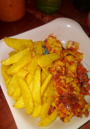 A picture of Fried Irish potatoes with fried eggs.