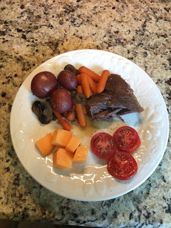 A picture of Chuck Pot Roast with Baby Carrots & Baby Red Potatoes.