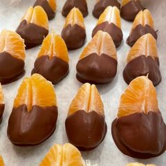 A picture of Chocolate dipped Mandarin Oranges🍊.