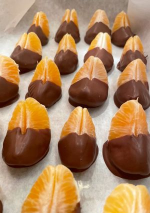 A picture of Chocolate dipped Mandarin Oranges🍊.